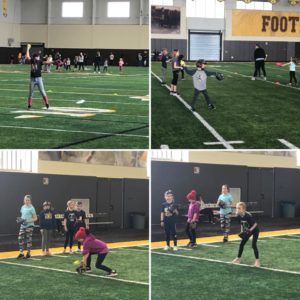 Girls playing softball at clinic